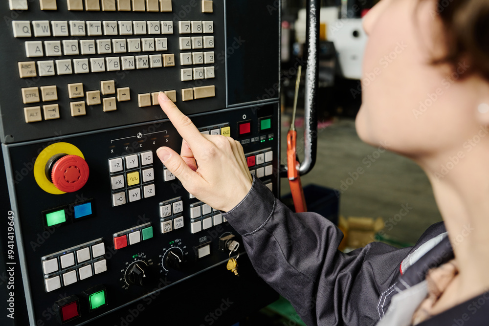 Manually Operating Machine Person manually operating control panel of industrial machinery in a ...