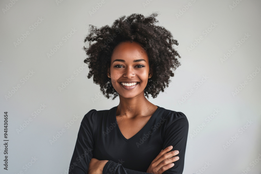 A series of portraits features a smiling young Black woman with natural curls, highlighted against simple white backdrops.
A series of portraits features a smiling young Black woman with natural curls, highlighted against simple white backdrops.