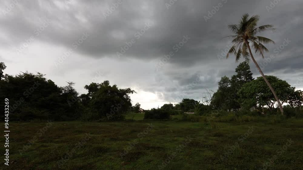 natural background of the evening atmosphere of a house in a rural community, with the changing light of the sky, the cloudy weather during the rainy season, the wind blowing through in a cool blur natural background of the evening atmosphere of a house in a rural community, with the changing light of the sky, the cloudy weather during the rainy season, the wind blowing through in a cool blur