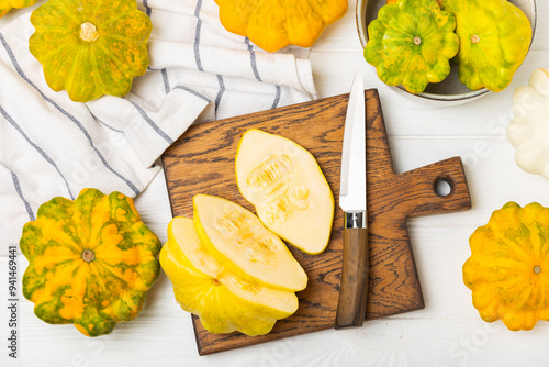 Pattypan zucchini on a textured kitchen table. squash. Fresh organic pattypan squashes on background. Vegan. Farmer's Market. Patisson. Space for text. Copy space. photo