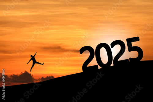 Concept Happy new year 2025 Silhouette image of happy man jump to 2025 on beautiful sunrise.