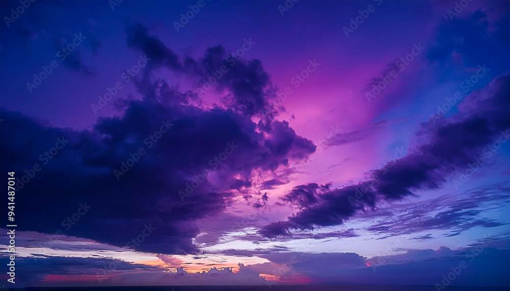 Fototapeta premium vibrant purple, magenta, violet, navy blue, and cloud-filled twilight sky vibrant sunset