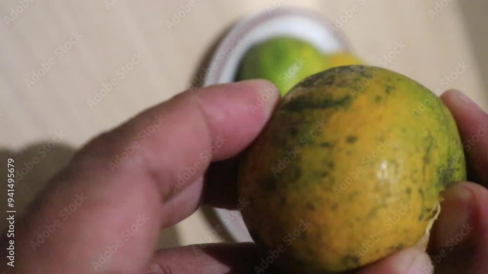 Peeling Orange Fruit. This fruit has a round shape and contains high levels of vitamin C. Peeling Orange Fruit. This fruit has a round shape and contains high levels of vitamin C.