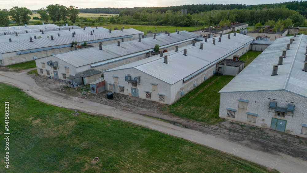 Drone photography of an old indoor chicken factory during summer day Drone photography of an old indoor chicken factory during summer day