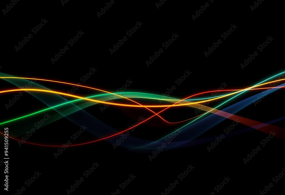 Naklejka premium Brightly colored light trails overlapping on a dark background