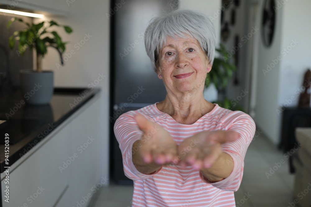 Senior woman supporting cooperation with hand gesture Senior woman supporting cooperation with hand gesture