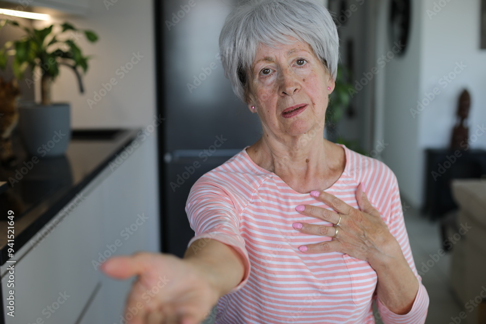 Senior woman begging for something with hand gesture Senior woman begging for something with hand gesture