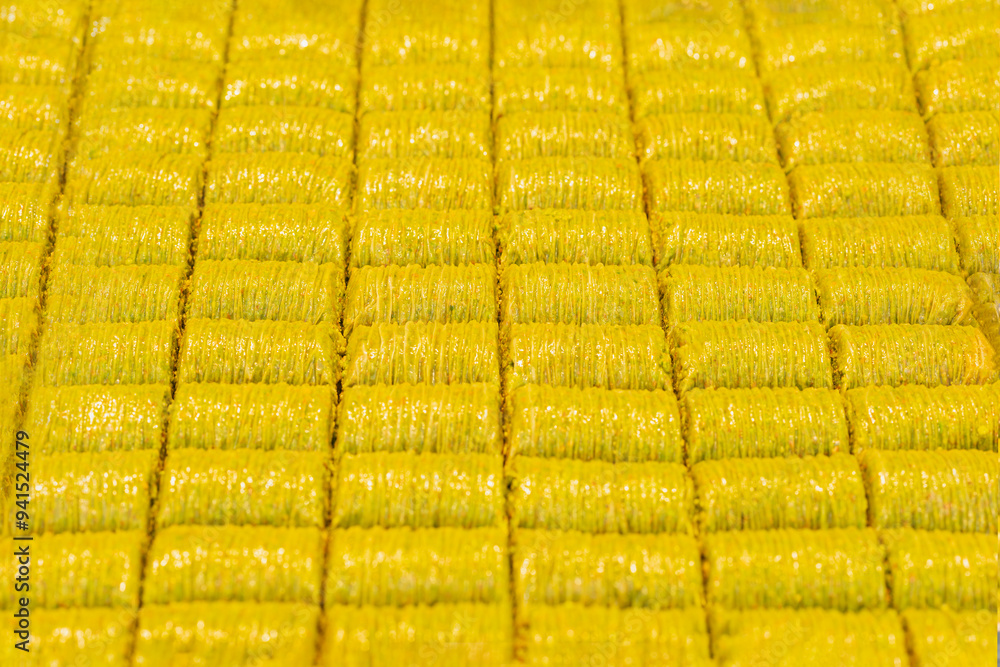 Fototapeta premium Rows of golden, crispy baklava neatly arranged in a pattern