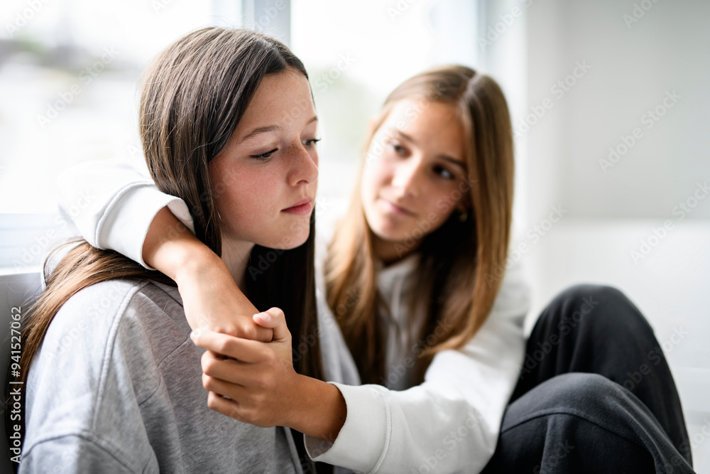 Depress and sad Teen girl sit on sofa wearing hoodies Depress and sad Teen girl sit on sofa wearing hoodies