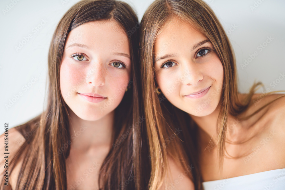Two best girls having fun together on white studio Two best girls having fun together on white studio