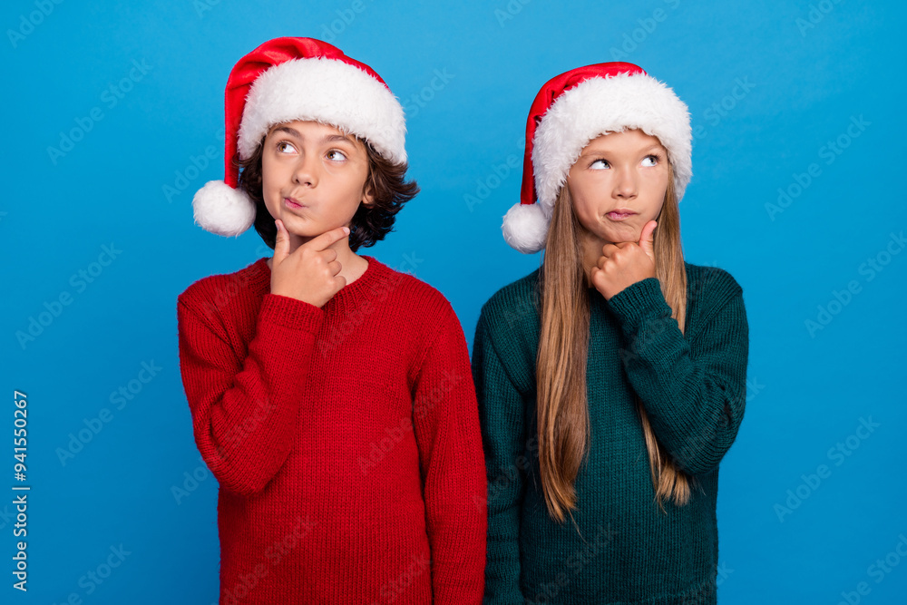 Photo of thoughtful two people kids thinking look up isolated blue color background Photo of thoughtful two people kids thinking look up isolated blue color background