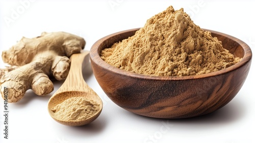 Fresh ginger roots and ginger powder in a wooden bowl with a spoon on a white background 
