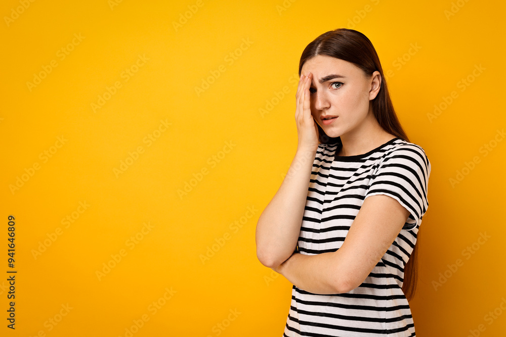 Portrait of scared woman on orange background. Space for text Portrait of scared woman on orange background. Space for text