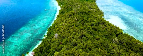 
Discover Raja Ampat in Papua, Indonesia, with amazing turquoise waters, stunning sandbanks, and vibrant sea life. Perfect for a holiday, enjoy a drone's aerial view of this tropical paradise