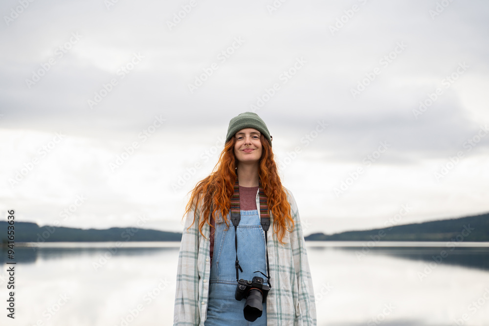Young woman enjoying nature during a lakeside camping trip Young woman enjoying nature during a lakeside camping trip