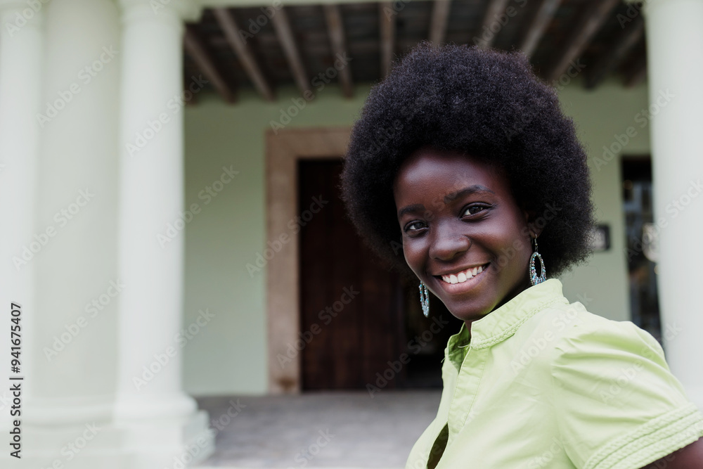Fototapeta premium portrait of African American woman with afro hair, young caribbean girl in Latin America 