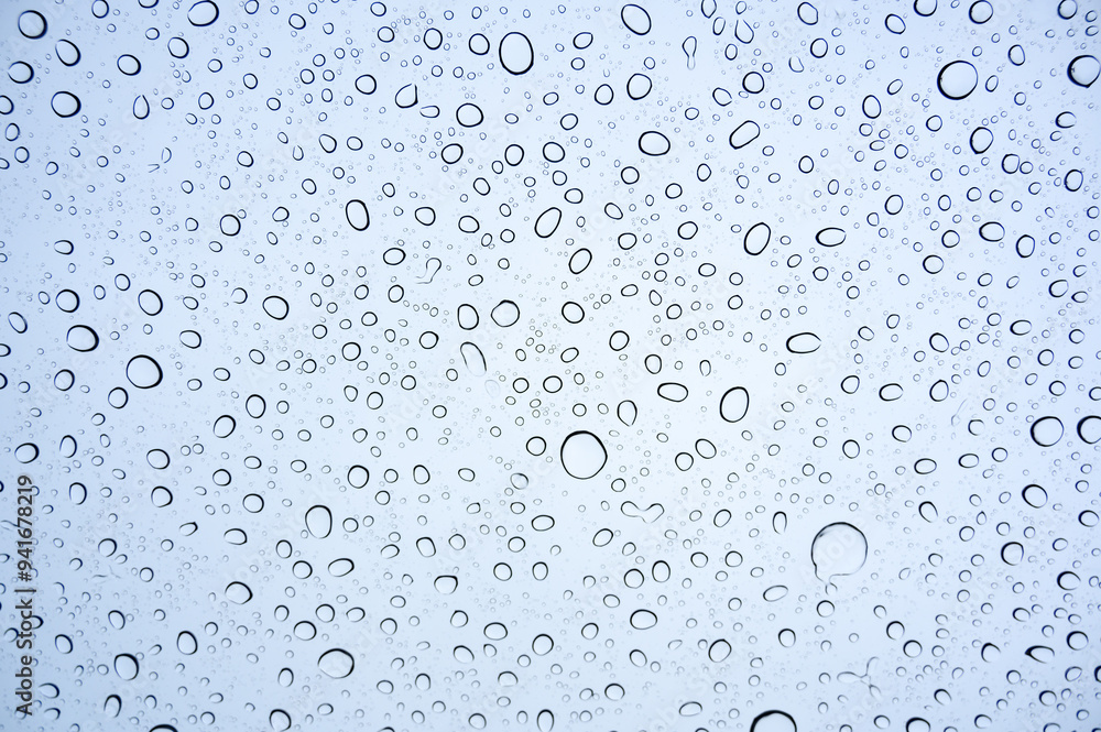 Raindrops on glass, Drops of rain on clear window. Raindrops on glass, Drops of rain on clear window.