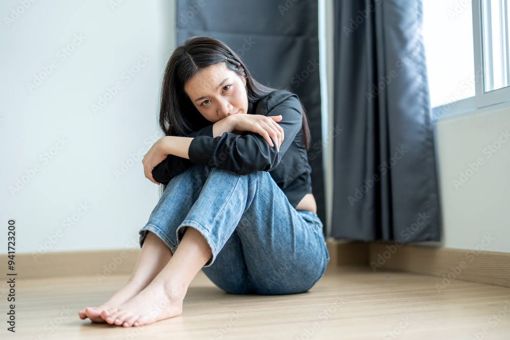 Young woman feeling sad and depressed on the floor at home Young woman feeling sad and depressed on the floor at home
