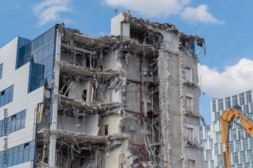 Demolition of a building. The wreckage of a demolished building. Demolition of a building. The wreckage of a demolished building.