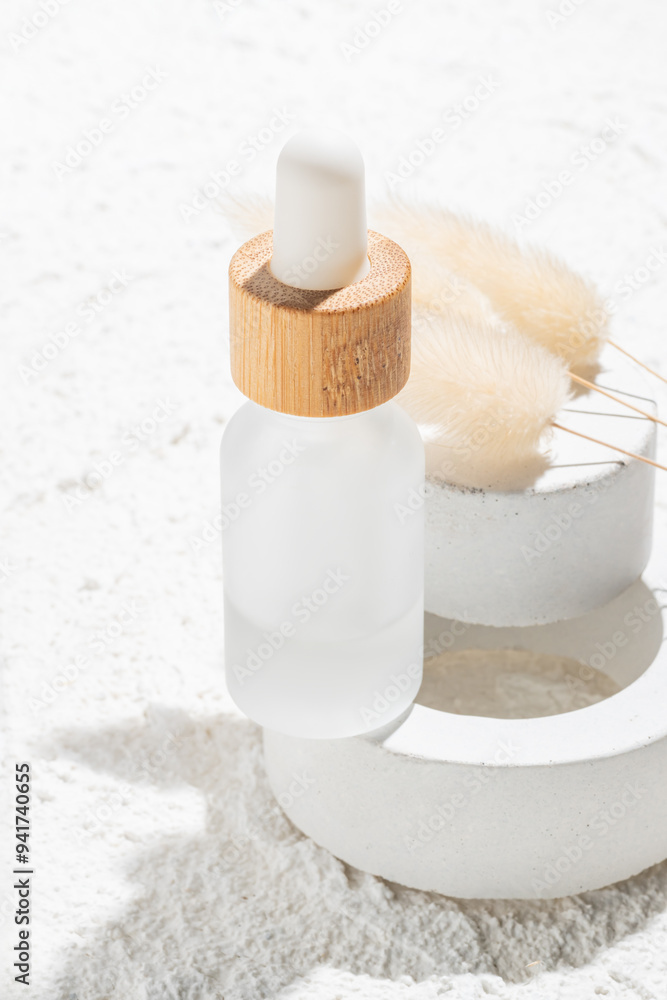 Elegant skincare bottle with natural accessories on stone Elegant skincare bottle with natural accessories on stone