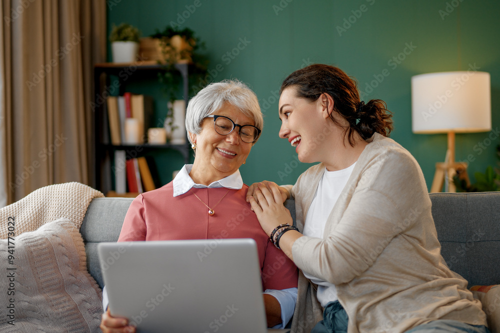 Young and senior women are using laptop Young and senior women are using laptop