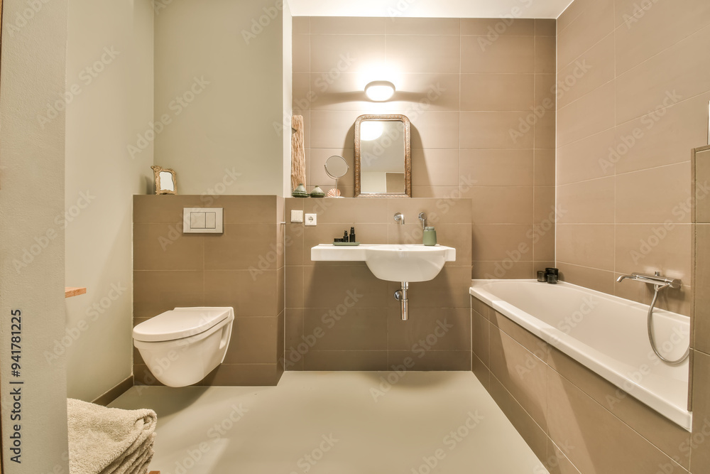 Modern taupe-tiled bathroom interior with bathtub Modern taupe-tiled bathroom interior with bathtub
