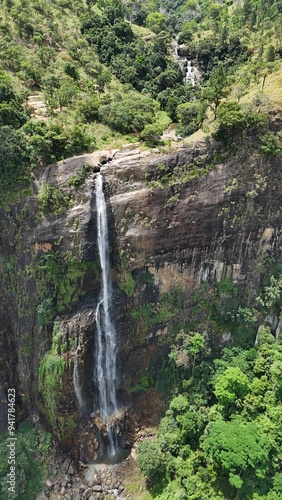 Waterfall in the jungle with natural pools on top. Drone view. Diyaluma Waterfall, Sri Lanka. photo