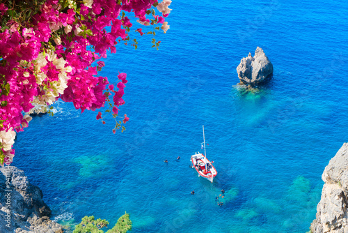 Fototapeta Naklejka Na Ścianę i Meble -  Paleokastritsa beach, small bay and Ionian sea clear water on Corfu, Greece, view from above