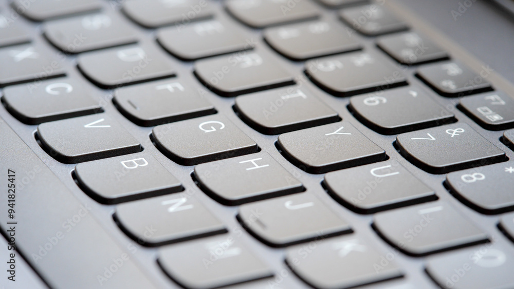 Simple new clean silver grey modern laptop keyboard, nobody, wide shot, shallow DOF, no people, angle. Creative content writing online freelance jobs symbol, abstract concept, blogging, SEO articles Simple new clean silver grey modern laptop keyboard, nobody, wide shot, shallow DOF, no people, angle. Creative content writing online freelance jobs symbol, abstract concept, blogging, SEO articles