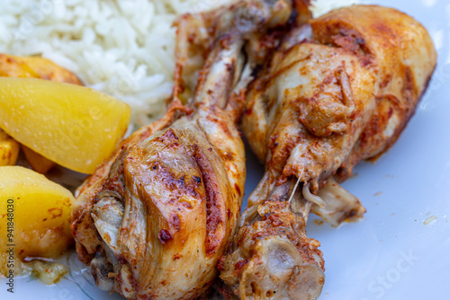 Obraz na płótnie oven-fried chicken legs, french fries and rice pilaf. w salonie