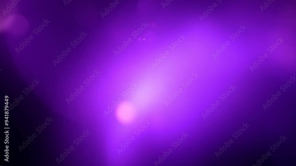 Purple abstract light flow with soft bokeh effect on black background Purple abstract light flow with soft bokeh effect on black background
