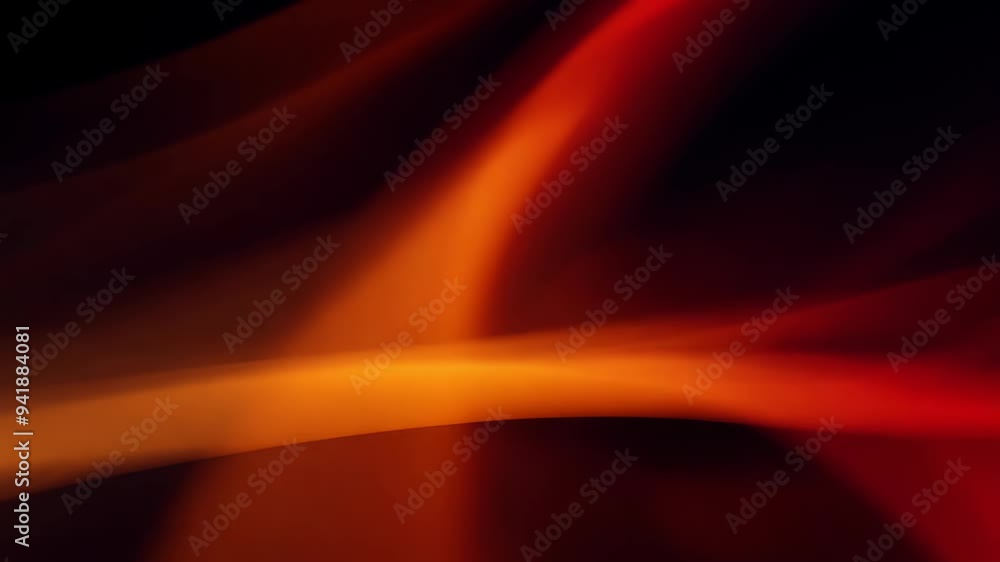Red and orange abstract light flow with soft bokeh effect on black background