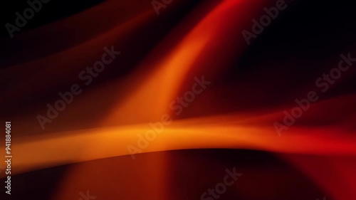 Red and orange abstract light flow with soft bokeh effect on black background