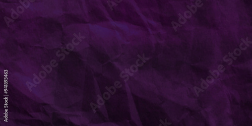 Purple crumpled paper texture in low light background. Silk cloth texture. Fabric pattern. crumpled kraft paper. A crumpled sheet of dark pink and purple paper abstract background. old paper texture. 
