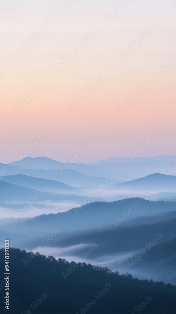 Majestic blue mountain landscape at dawn with mist and soft hues Majestic blue mountain landscape at dawn with mist and soft hues