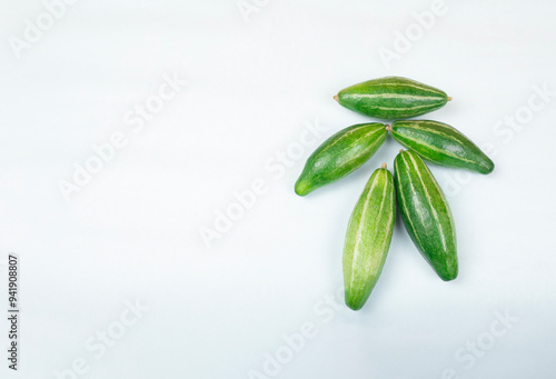 Potol is a small, green, Pointed Gourd that is native to India, also called Parval in Hindi and Putulika in Sanskrit.   It is a vital summer vegetable in Bangladesh and West Bengal. Pointed Gourd. photo