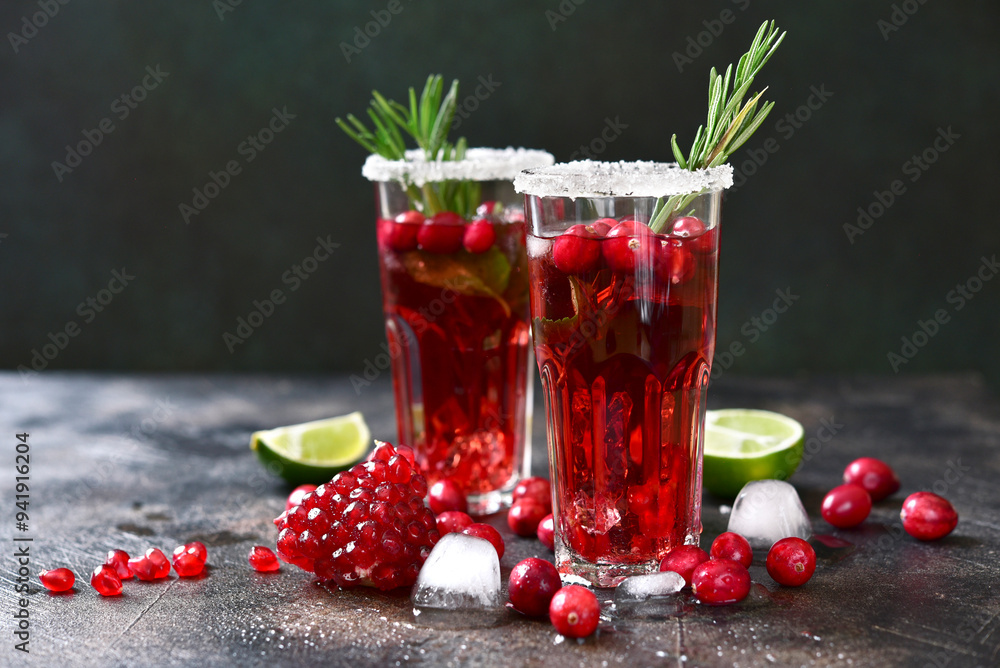 Cranberry cocktail with pomegranate and rosemary. Cranberry cocktail with pomegranate and rosemary.