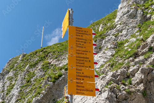 Various Hiking trails indicators on top of Mount Pilatus, signs pointing to various trail directions and times. Switzerland photo