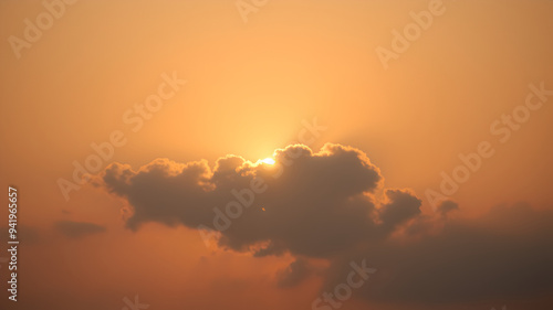 Background texture of a cloud behind which the sun rises