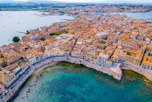 Aerial of Ortigia island, old town with turquoise sea of Syracuse. Small island on Sicily, Italy. photo