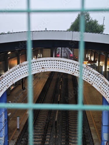 Close-up through the underground bridge fence
