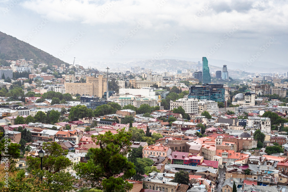 Obraz premium above view of Tbilisi city on summer cloudy day