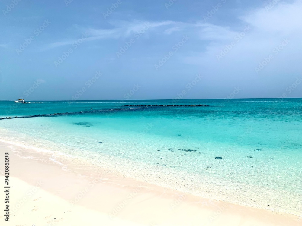 Turks and Caicos beaches feature soft, white sand blending seamlessly into crystal-clear turquoise waters. The gentle waves and endless horizon create a serene and picturesque tropical escape. Turks and Caicos beaches feature soft, white sand blending seamlessly into crystal-clear turquoise waters. The gentle waves and endless horizon create a serene and picturesque tropical escape.