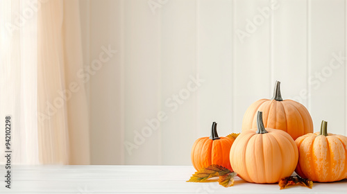 Pumpkins on a table with fall leaves and autumn decor capturing the essence of harvest season