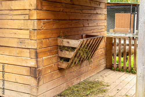 Принти на полотні Wooden feeder with hay. Feeding trough for herbivorous animals