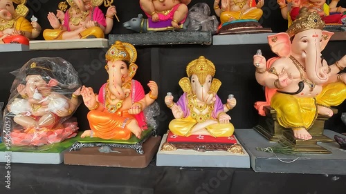 27 August 2024, Newly made idols of the God known as Ganesha or Ganapati for sale at a shop on the eve of Ganesh festival in Pune, India. photo