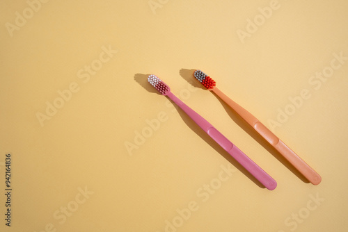 Colored toothbrushes on a color background. Replace your old toothbrush with a new one. Old and new toothbrushes. Dental health and hygiene concept 