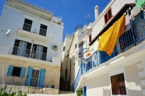 Typical white houses of Vieste in a summer day, Gargano, Puglia, Italy photo