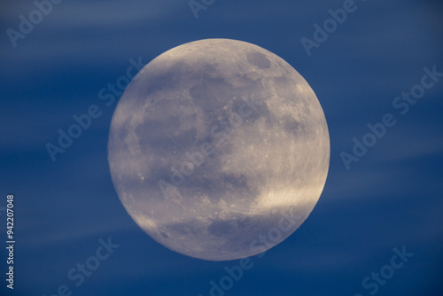 Obraz na płótnie photograph of the full moon partially covered with clouds w salonie