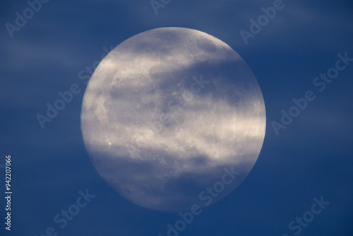 Obraz na płótnie photograph of the full moon partially covered with clouds w salonie